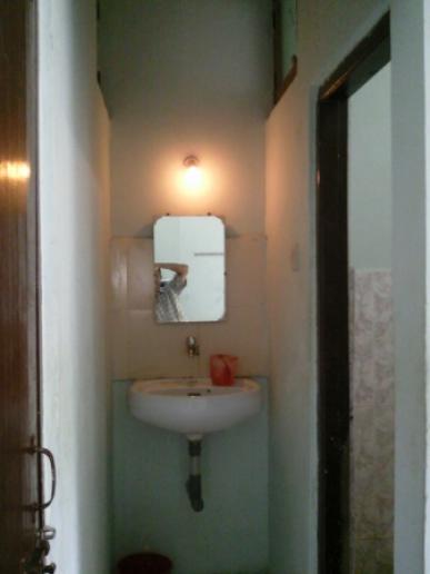 Toilet with outside wash basin
